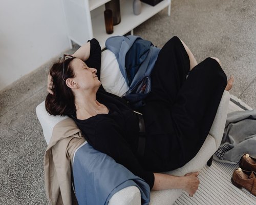 Person resting after a regular workday, calm interior